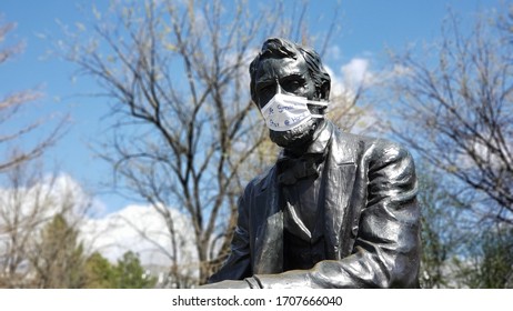 Boise, Idaho April 16, 2020 - Abraham Lincoln Statue In Julia Davis Park In Boise, Idaho Wearing A Cloth Face Mask During The COVID-19 Coronavirus Crisis. 