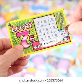 BOISE, IDAHO - DECEMBER 21, 2013: A Lucky 7 scratch ticket being played in hopes of winning a cash prize
