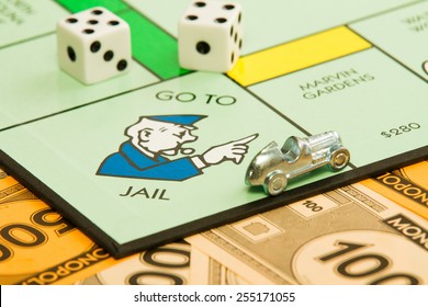 BOISE, IDAHO - NOVEMBER 18, 2012:  The Car Piece Is Speeding Away From The Go To Jail Spot On The Famous Hasbro Game Monopoly.