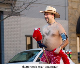 BOISE, IDAHO/USA FEBRUARY 13, 2016: Man On His Pretend Horsie During The Cupid Undie Run