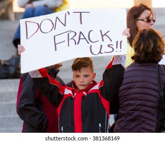 BOISE, IDAHO/USA - FEBRUARY 22, 2016: Child Holding An Anti Fracking Sign With A Play On Words In Boise, Idaho