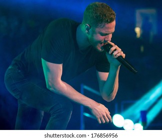 BOISE, IDAHO/USA - FEBRUARY 8, 2013: Dan Reynolds Bends Over To Sing To The Crowd During The Night Visions Tour