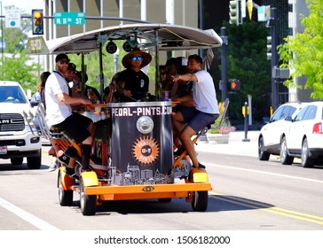 Boise, ID/USA-July 13, 2019: Patrons Enjoy Drinks Aboard A Pedal-bar, One Of Several Now Cruising The Streets Of Boise. Once Banned, They Required A Special City Variance For Open Containers.  