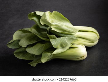 Bok Choy, Chinese Cabbage On Black Background, Side View.
