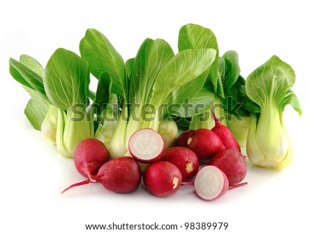 Bok choy (chinese cabbage) and radishes on white background