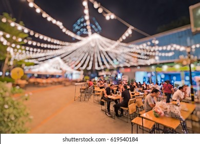 Bokeh background of Street Bar beer restaurant, outdoor in asia, People sit chill out and hang out and listen to music together, Happy life ,work hard play hard , Local street restaurant Business icon