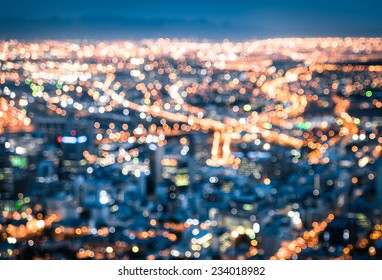 Bokeh of Cape Town skyline from Signal Hill after sunset during the blue hour - South Africa modern city with spectacular nightscape panorama - Blurred defocused night lights - Powered by Shutterstock