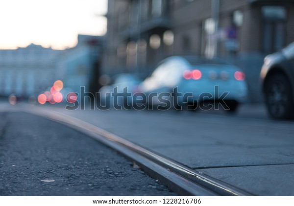 Bokeh car\
Lights in the big city. Asphalt and tram tracks on the background\
of bright red lights of\
cars.\
