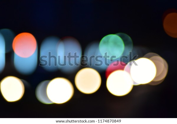 Bokeh\
cars in city at time night town circles\
colorful