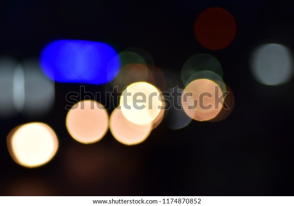 Bokeh\
cars in city at time night town circles\
colorful