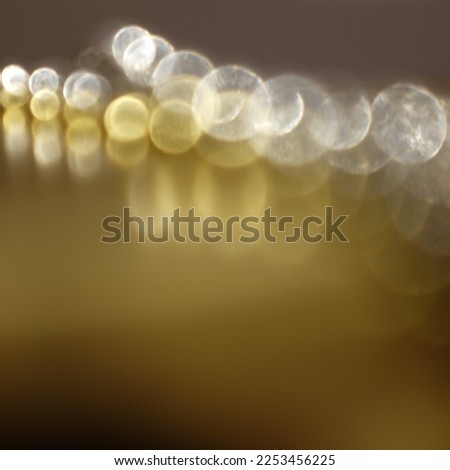 bokeh effect with gold and white orbs