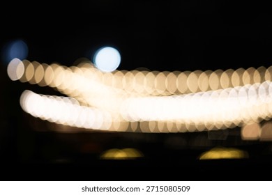 Bokeh effect of warm lights creating a dreamy ambiance at night.