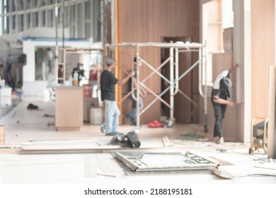 Bokeh image of event setup. Blur image of engineer and backstage crew team working to setting in exhibition hall event. Background image concept. - Shutterstock ID 2188195181