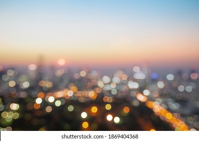 Bokeh light and blur modern city skyline sunrise background. Bangkok, Thailand, Asia