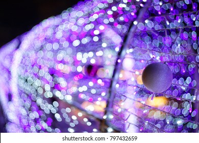 Bokeh lighting background from light blue, purple, white, with blurred and ultraviolet bokeh, perfect for Christmas or New Year accompanying festivals.