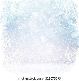 bokeh lights background with multi layers and colors of white silver and blue with snowflakes overlay