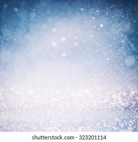 bokeh lights background with multi layers and colors of white silver and blue