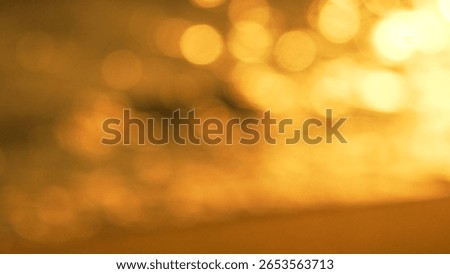 Bokeh Lights Sunset Reflection Abstract - Blurry photo of sunset reflected on water, creating bokeh effects.