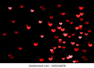 Bokeh red lights isolated on black background. Heart-shaped, love concept, Valentine's Day, February 14 - Powered by Shutterstock