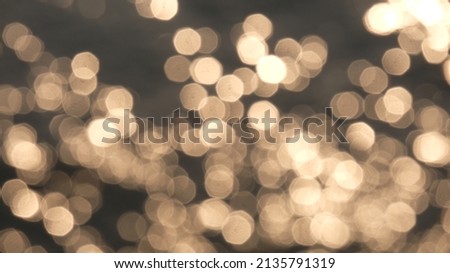 Bokeh of sun light refection with the sea blured photo,Beautyful nature Background,Abstract photo