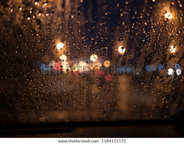 Bokeh through
window in car in the raining
night
