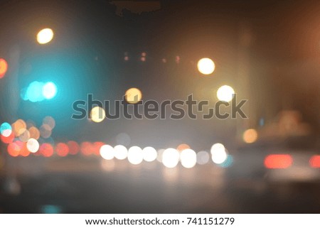 bokeh traffic lights and city lights in the background