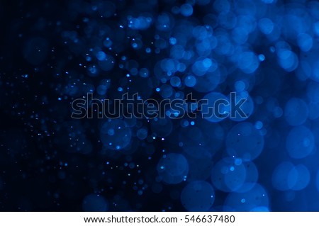 bokeh of water fly and lights on black background