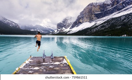 Bold jump into the cold waters of Maligne Lake in Jasper National Park - Shutterstock ID 759861511