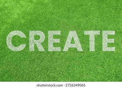 Bold white "CREATE" text stenciled onto a vibrant green grass texture. A clean, motivational concept for growth and innovation.