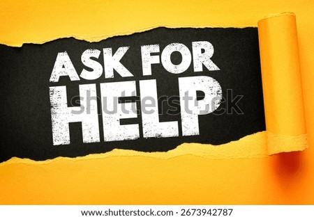 Bold white text ASK FOR HELP revealed through torn yellow paper on black background. Concept for support, guidance, assistance, outreach, advice, teamwork, or seeking help in tough situations
