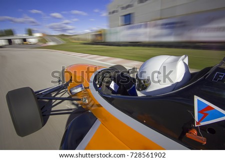 bolide driving at high speed in circuit.Camera on board