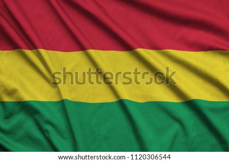 Bolivia flag  is depicted on a sports cloth fabric with many folds. Sport team banner