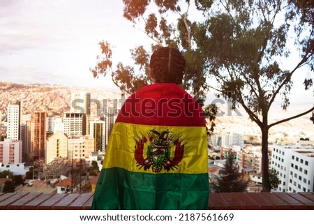 Bolivian woman covered with her national flag, Bolivia August 6 national holidays