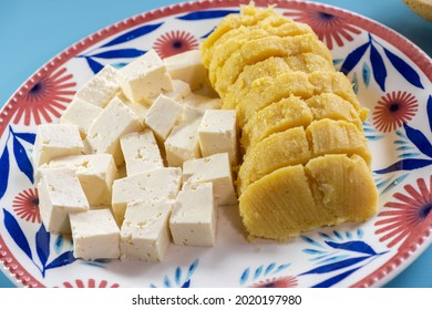 Bollos Corn Of  With Cheese And Whey On Plate On Blue Background.