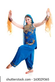 Bollywood dancer in traditional beautifu lblue dress performing with orange scarfs
