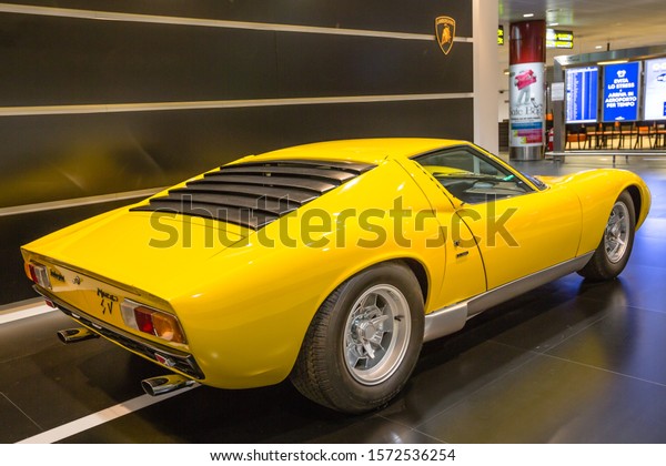 Bologna airport,\
Italy - June 16, 2014: backside view of a rear mid-engined\
Lamborghini Miura SV car on exhibition in Bologna airport. A\
supercar produced between 1966 and\
1973.
