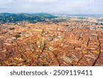 Bologna, Italy. 12th-century towers overlooking the city, built by noble Italian families. Symbol of Bologna. Panorama of the city on a summer day. Sunny weather. Aerial view