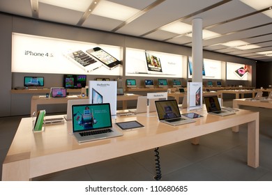 BOLOGNA, ITALY - AUGUST 6: People visiting the Apple Store on August 6, 2012 in Bologna, Italy. Apple has 363 stores worldwide, with global sales of US$16 billion in merchandise in 2011.
