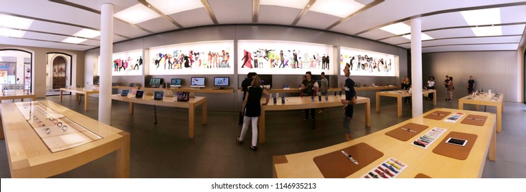 BOLOGNA, ITALY - JULY 2018: Clients Inside The Apple Store. Panoramic Image.