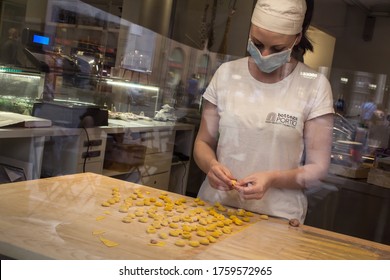 Bologna, Italy - June 7, 2020: Workers Return To Work After The Relaxation Of Restrictions: Worker With Mask Model Bolognese Tortellini (Covid-19 Pandemic)