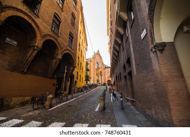 BOLOGNA, ITALY - October, 2017: Old Street View Bologna City, Italy. Cobble Stone Street With Bollards. Renaissance Buildings