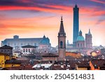 Bologna, Italy rooftop skyline and famous historic towers at dusk.