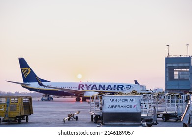 Bologna Marconi Airport on 07 March 2022 at sunrise. Ryanair plane preparing to boarding.