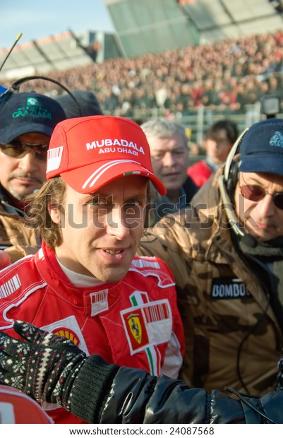 BOLOGNA,ITALY-06 DECEMBER: luca badoer\
,ferrari\'s official test driver interviewed by television at the\
2008 edition of Motor Show in\
Bologna,Italy