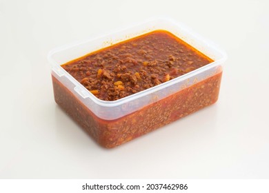 Bolognese Tomato Pasta Sauce In A White Plastic Casserole, Freezer Ready. Close Up Studio Shot, No People.