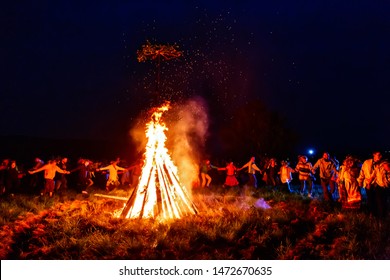 BOLSHAYA RECHKA, RUSSIA - JUNE 24 2017: Celebrating Of Belorussian Holiday Ivan Kupala Near The River Angara By Community Krivichi, People Doing Cicle National Dance Around Symbolic Fire