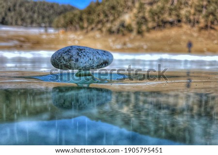 Bolshoe Goloustnoe, Baikal lake, Siberia. Stones on the ice