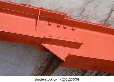 Bolted Connection Of Steel Beams. Metal Construction Covered Primer Red Iron Oxide.