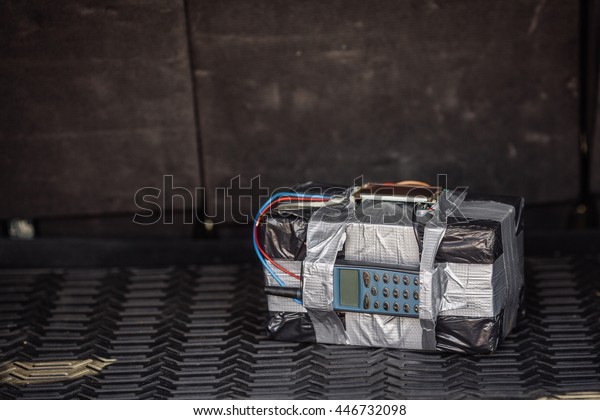 bomb with radio\
control and digital countdown timer lies in the car. terrorism and\
dangerous life concept