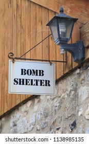 Bomb Shelter Sign Hanging On The Wall